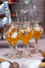 Tasty appetizers served in glass jars 