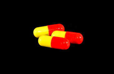 medical pills isolated on black background