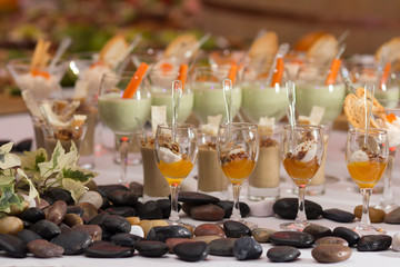 Tasty appetizers served in glass jars