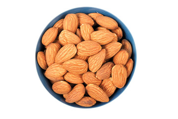 almond seeds in bowl isolated on white background.  top view