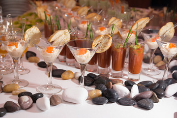 Tasty appetizers served in glass jars