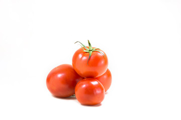 A few tomatoes on a white background.