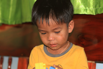 Portrait of a small boy crying
