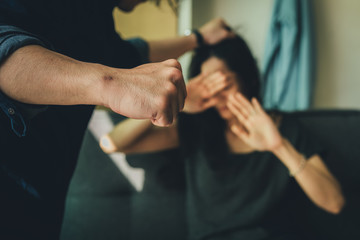 Obraz na płótnie Canvas drunk husband hit attacking scared wife in house.help victim of domestic violence, Human trafficking.stop physical abuse women concept