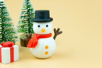Snowman with black hat and red scarf