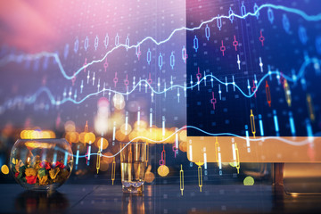 Financial graph colorful drawing and table with computer on background. Double exposure. Concept of international markets.