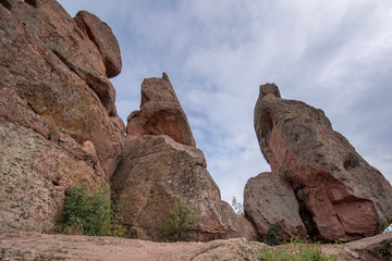 Fototapeta premium Beautiful landscape with bizarre rock formations. Stone stairs leading to the amazing rock formations and walls of a medieval fortress in Belogradchik, northwest Bulgaria. Panorama