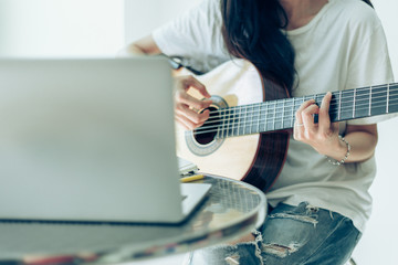 artist songwriter thinking writing notes,lyrics in book at studio.man playing live acoustic guitar relax chill.concept for musician creative.composer work process.people relaxing time with instrument