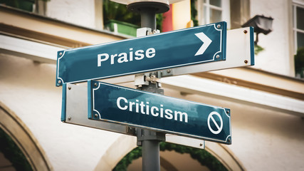 Street Sign Praise versus Criticism - obrazy, fototapety, plakaty