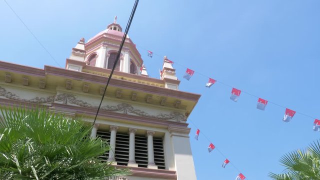 Banners Hanging In The Steeple Of Santa Cruz Roman Catholic Church In Bangkok, Thailand - Medium Shot