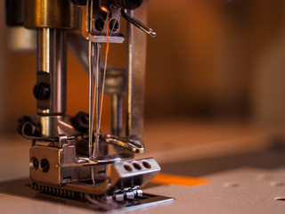 Sewing machine needle in the sewing workshop