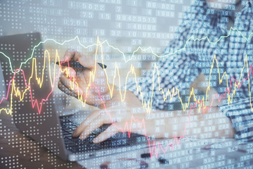 Double exposure of forex graph with man working on computer on background. Concept of market analysis.