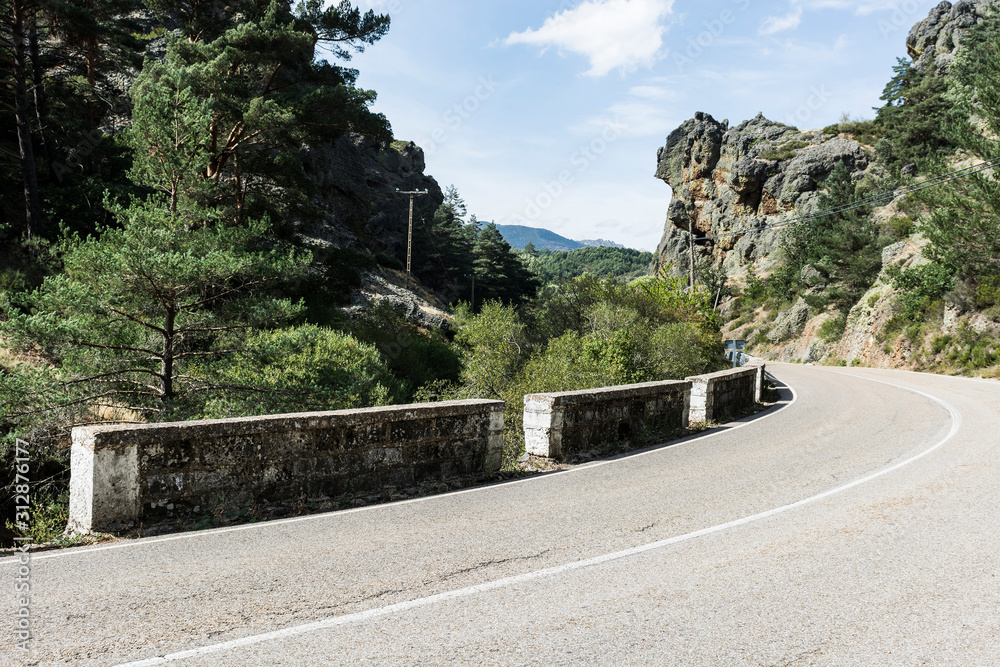 Wall mural Winding asphalt road in Spain