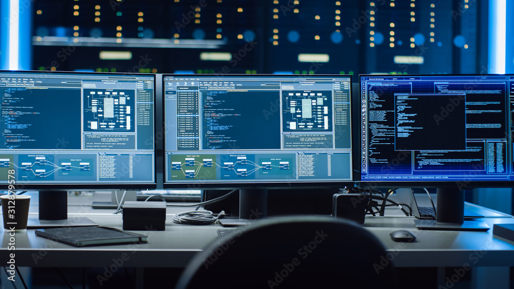 Aufkleber Shot of Multiple Personal Computer Monitors Showing Coding Language Program with System Monitoring Interface. In the Background Data Center with Server Racks.