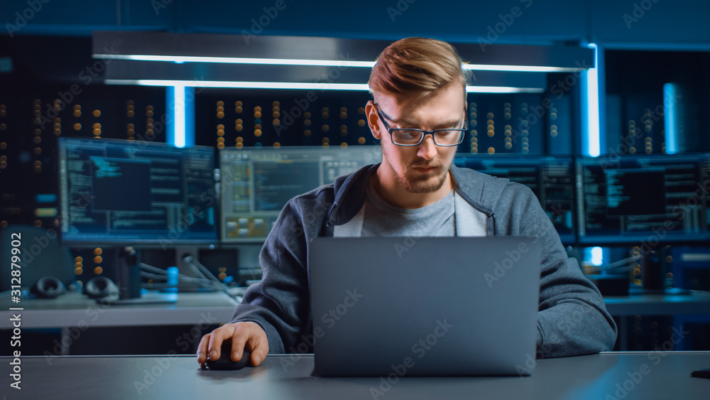 Poster Portrait of Software Developer / Hacker Wearing Glasses Sitting at His Desk and Working on Computer in Digital Identity Cyber Security Data Center. Hacking or Programming.