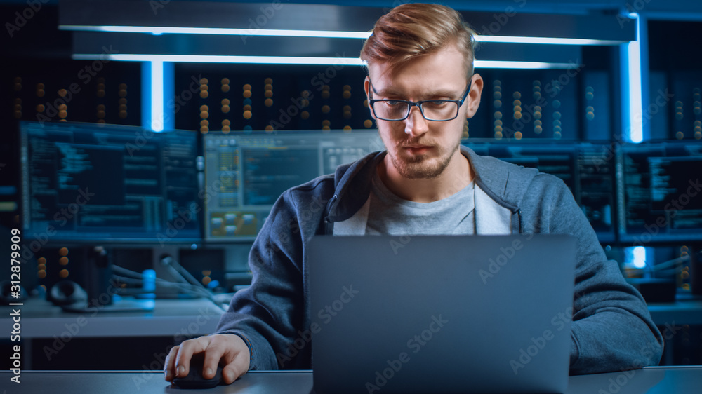 Poster Portrait of Software Developer / Hacker Wearing Glasses Sitting at His Desk and Working on Computer in Digital Identity Cyber Security Data Center. Hacking or Programming.