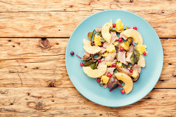 Meat salad with pineapple.