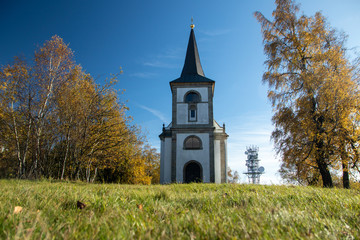 Fototapeta na wymiar Church on the top of Zvicina in autumn