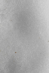 Clean white snow in a closeup during springtime in Finland. In this photo you can see melting clean snow, beautiful even surface. Color macro image. Seasonal background photo.