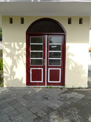 Red entrance glass doors with arch glass bouvenlicht