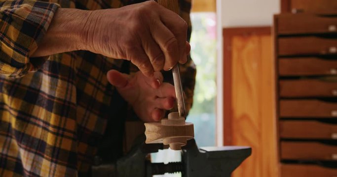 Female luthier at work in her workshop