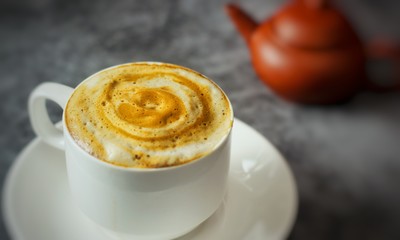 cup of coffee with whipped cream on a white background