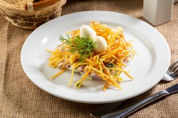 Russian salad on white plate