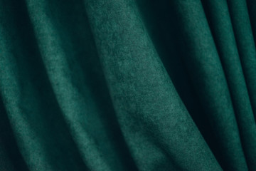emerald luxury fabric background with copy space, drapery, selective focus, film and grain photo