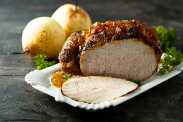 Homemade glazed ham with pear sauce
