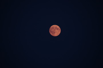 red moon in smokey sky