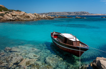 Fototapeta na wymiar small boat in the turquoise sea in Sardinia