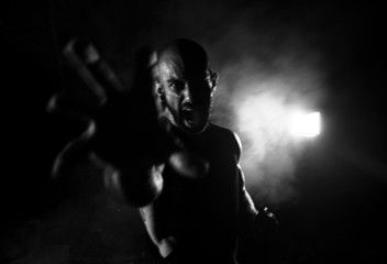 Angry man screaming at camera, long exposure effect