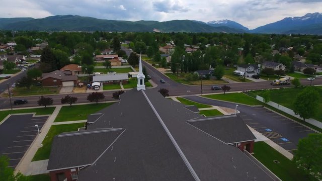 Aerial low over a church steeple