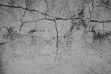 Texture of a concrete wall with cracks and scratches which can be used as a background