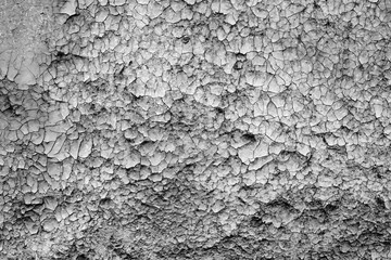 Texture of a concrete wall with cracks and scratches which can be used as a background