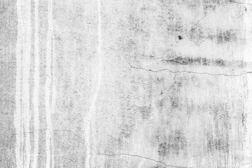 Texture of a concrete wall with cracks and scratches which can be used as a background