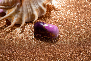 One modern candy on golden background