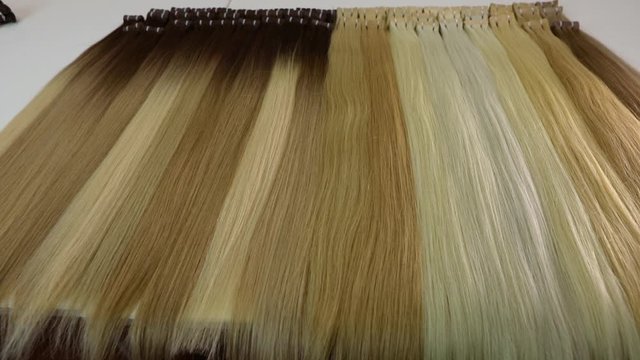 Long beautiful female hair, artificial long female hair in light shades
