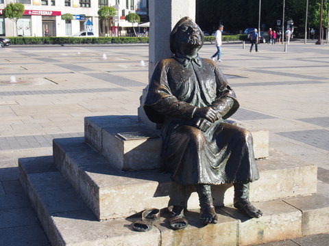 Statue of a pilgrim resting on the road to Santiago de Compostela, Camino de Santiago, Way of St. James, Journey from Mansilla de las Mulas to Leon, French way, Spain