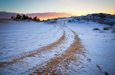 ATV auto sport track at winter. Wheel sandy tracks on snow