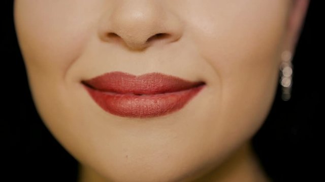 The girl laughs at the camera, close-up