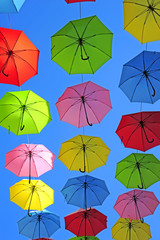 Fototapeta na wymiar Colored Umbrellas in blue sky in Jerusalem Israel