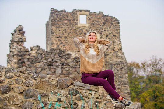 Woman Makeup Face Sit On Stony Ruins Background Defocused. Tourism Concept. Explore Midcentury Castle Ruins. Fashionable Girl Tourist. Vacation And Travel. Travel Agency. Travel Destinations