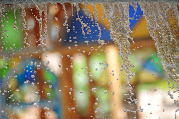 water drop with multicolored background - Waterworks