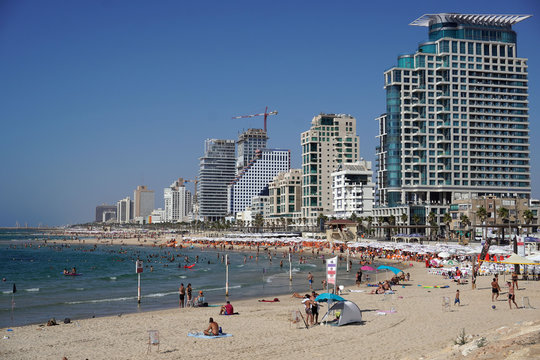 Israel January 12,2020 Panoramic view of the Tel-Aviv public beach and promenade on Mediterranean sea and skyline of the city . Israel