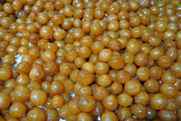 Variety of sweets on the arab street market stall. Eastern sweets in a wide range, baklava, Turkish delight with almond, cashew and pistachio nuts in old city market Jerusalem      