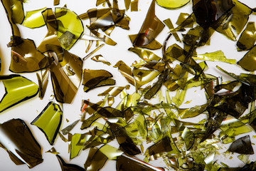 broken glass bottles on white background. recycling concep