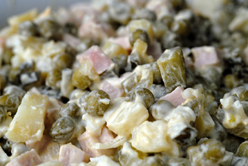 Olivier salad seasoned with mayonnaise. Shallow depth of fields