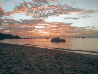 Red/pink/orange sunset at the beach in koh tao thailand