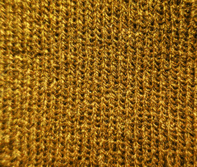 Knitted wool yellow gold seamless grainy threads texture background